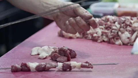 Arranging Mutton and Tail Fat on Traditional Kebab Skewers Stock Footage 275123030