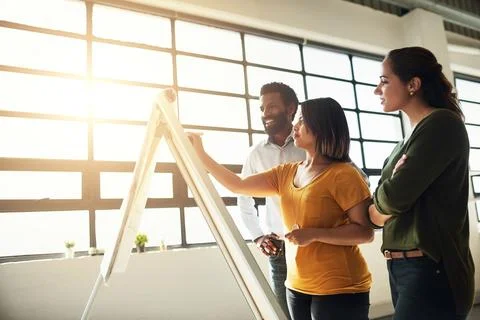 Arranging plans down to the detail to avoid any shortcomings. a group of Stock Photos