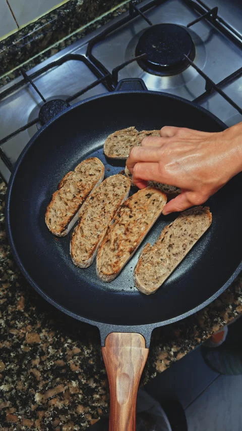 Arranging Slices of Multigrain Bread in Pan Stock Footage 277723829