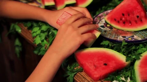 Arranging slices of watermelon Stock Footage 57756167