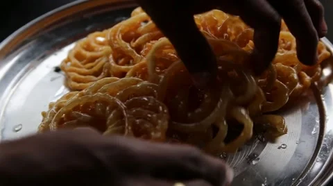 Arranging sweet Jalebi Stock Footage 65776492