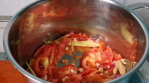 Arranging Tilapia Fish on top of Chopped Tomatoes Stock Footage 159319945