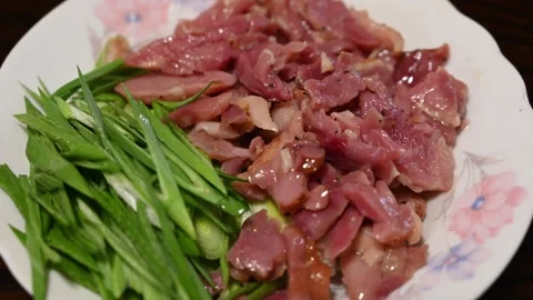 Arranging Yilan Cured Duck with Sliced Green Garlic Video stock 346488754