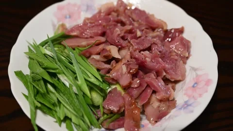 Arranging Yilan Cured Duck with Sliced Green Garlic Video stock 346488757