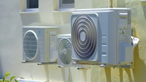 An array of air conditioning units mounted on a building wall, illustrating.. Stock Footage 292123417