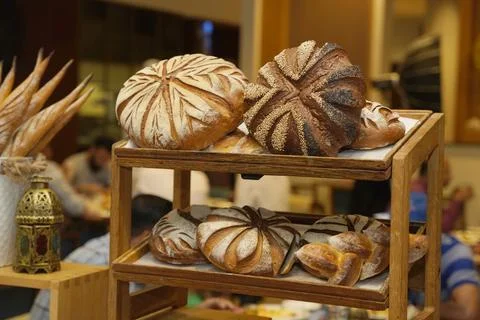 An array of artisan breads, including beautifully crafted loaves and rolls. Stock Photos