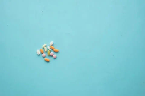 An Array of Assorted Vitamins and Medications Displayed on a Bright blue Surface Stock-Fotos