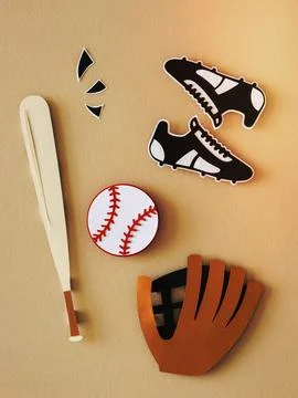 Array of baseball equipment arranged on a tabletop, featuring a pair of shoes, m Stock Photos