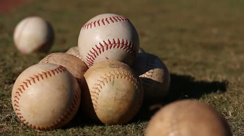 An array of baseballs on a field. Stock Footage 68894077