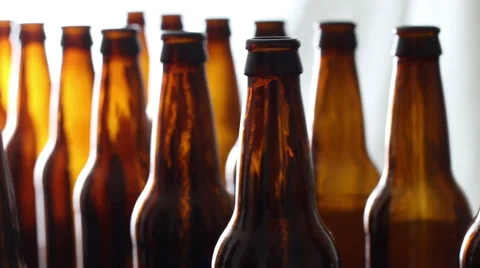 An array of beer bottles with a white background. Stock Footage 68796938