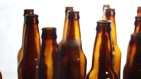 An array of beer bottles with a white background. Stock Footage 68797001