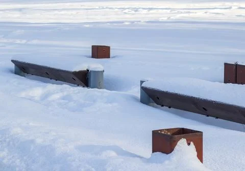 Array of the benches in a park covered with snow. Winter. Season Fotos de archivo