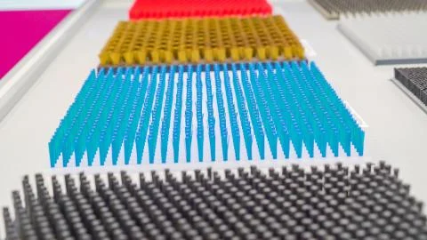 Array of blue spikes feathers on the white platform Stock Photos