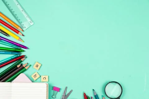 An array of Colorful Office Supplies beautifully arranged on a refreshing M.. Stock Photos