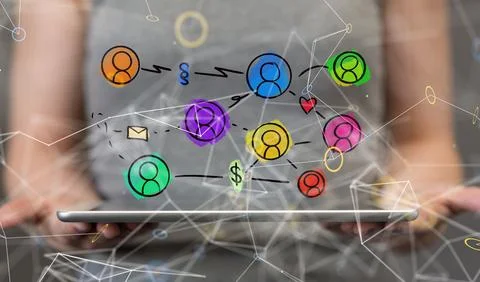 Array of colorful profile icons hovering above a tablet. Social media, communica Stock Photos