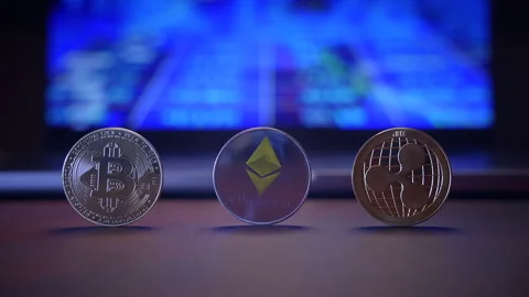 An array of Cryptocurrency Coins displayed against a vibrant and dynamic Stock Footage 296241013