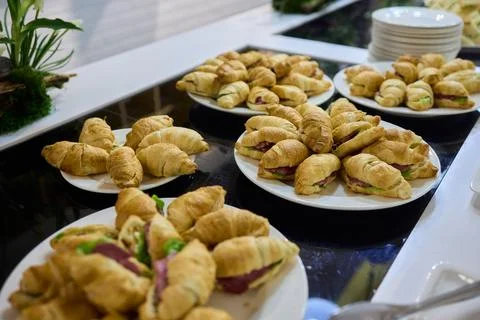 An Array of Delicious Assorted Pastries Elegantly on Display at the Buffet Table Fotos de archivo