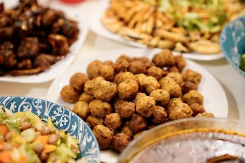 An array of food displayed on a dining table ready to be eaten Fotos de archivo