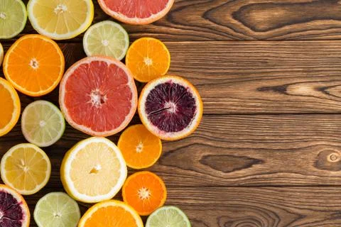 Array of fresh juicy halved citrus fruits Stock Photos