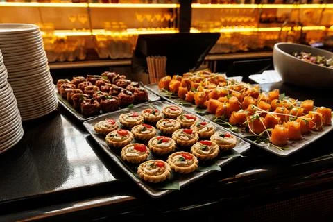 An array of gourmet appetizers, elegantly presented on trays. 写真素材