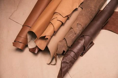 Array of leather fabric samples in different shades neatly placed on a table, re Fotos de archivo