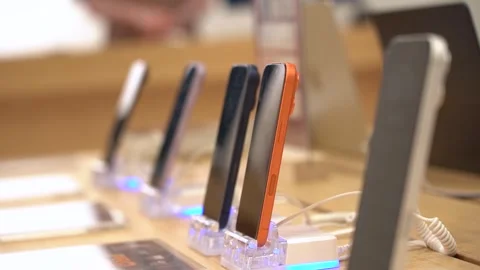 An Array of Modern Smartphones Displayed Elegantly on Charging Stands, Stock-Footage 332653142