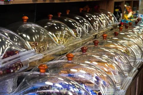 An Array of Pastries Under Glass Domes Showcasing Colorful Varieties of Sweets 스톡 사진
