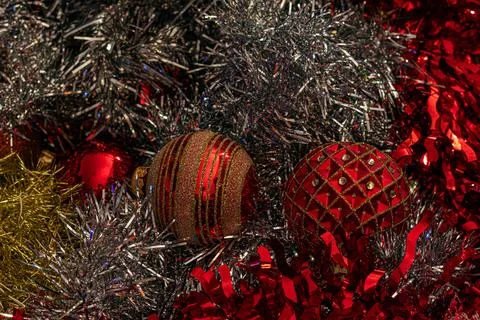 Array of red and gold Christmas ornaments, each uniquely designed, surround.. Stock Photos