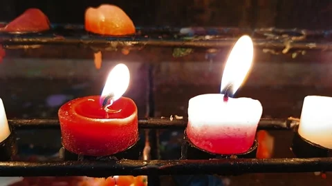 Array of round short lit candles in different colors Stock Footage 287897002