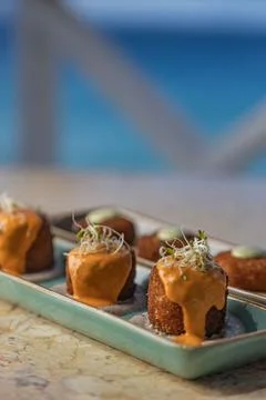 Array of small appetizers with sauce served on the marble table Foto stock