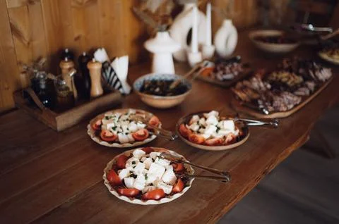 Array of small plates with a variety of delicious foods Foto stock