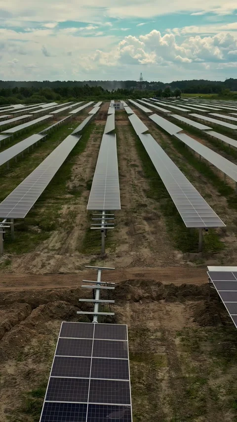 Array of solar panels on moody day, aerial vertical view Stock Footage 310646708