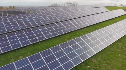 Array of solar power panels on sunset in Ukrainian field. Green energy in Stock Footage 191405118