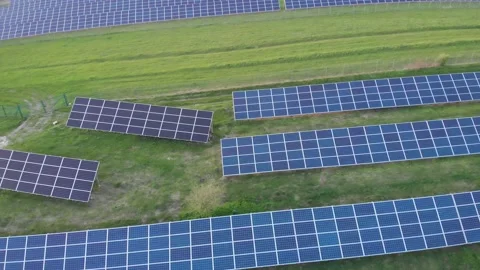 Array of solar power panels in Ukrainian field. Green energy in Europe Stock Footage 172576977