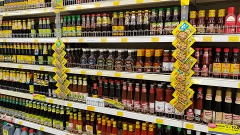 An array of soy sauce, chili, and tomato sauces bottle from diverse brands and Video stock 311555756