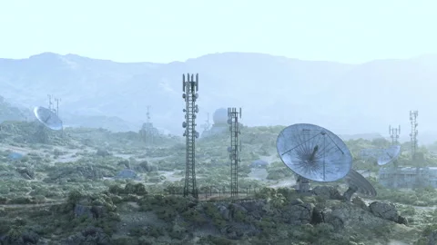 An array of surveillance antennas in a grassy field at an observatory Stock Footage 273144887
