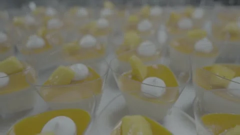 Array of tropical mousse cups with cream and fruit Stock-Footage 327357338