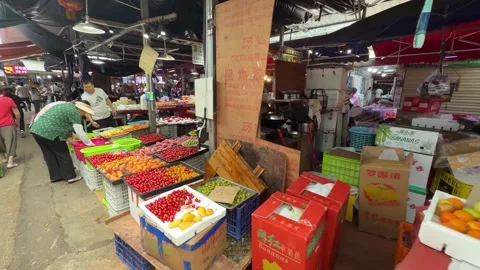 Array of vibrant, fresh fruits on stalls in the Supo Agricultural Products Stock Footage 336710463