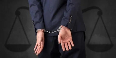 Arrested man with balance on the background Stock Photos