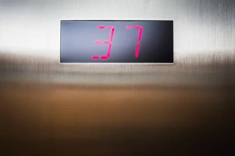 Arrival on the 37th floor in the elevator Stock Photos