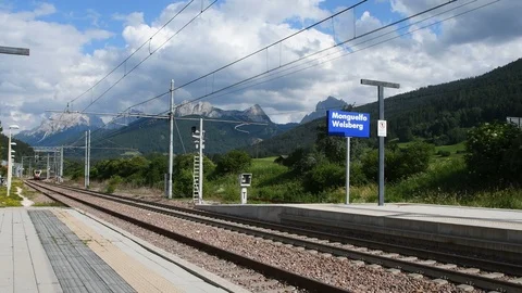 Arrival of the Alpine Train coming from San Candido at Monguelfo. Italy Stock Footage 113199730