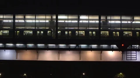 Arrival and departure of subway train on the station located on the bridge ov Stock Footage 80126543