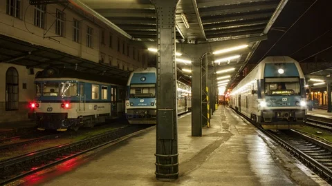 Arrival and departure of trains from the station at night Stock Footage