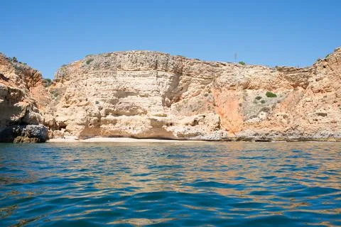 Arrival by boat to a beautiful empty beach in Algarve, Portugal. Impressive s Stock Photos