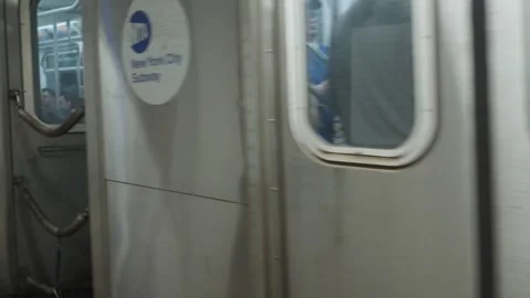 Arrival of a crowded New York subway local 6 train Stock Footage 243811276
