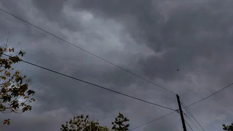 The arrival of dark cumulus clouds accompanied by wind Stock Photos