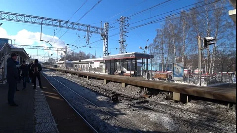 Arrival of the electric train to the suburban platform Stock Footage 89000202
