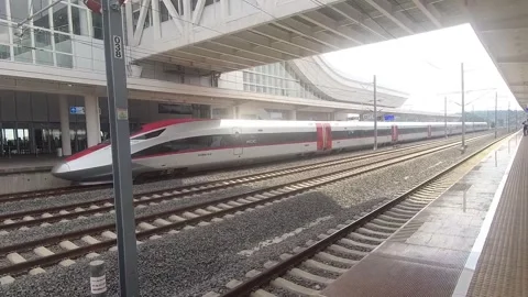 Arrival of the fast train at the fast train station in Padalarang, West Java Stock Footage 309974111