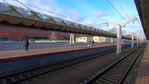Arrival of a high-speed passenger train to the station on a sunny day Video stock 143407952