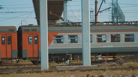 Arrival of large passenger train at depot. Shooting long-distance transport. Stock Footage 128701052